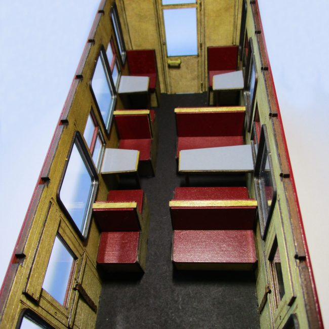 Carriage 104, assembled and painted third class saloon interior.