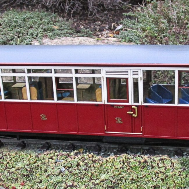 New Carriage 100 kit, assembled, painted and completed with addition of couplings and decals (Not supplied).